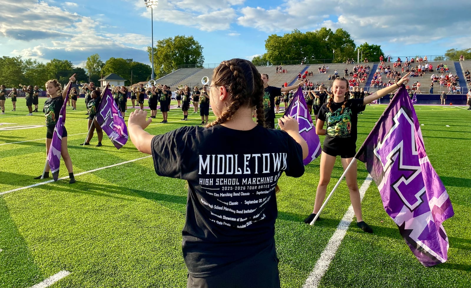 An excited crowd saw the unveiling Friday night of Middletown Schools’ new $750,000 football field at its team's season home opener at Barnitz Stadium. 
The Middletown High School football Middies took on the Troy High School football squad but the dazzling new synthetic turf and its colorful graphics shared the spotlight in what school officials described as more than a prep sporting event. (Photo By Michael D. Clark/Journal-News)