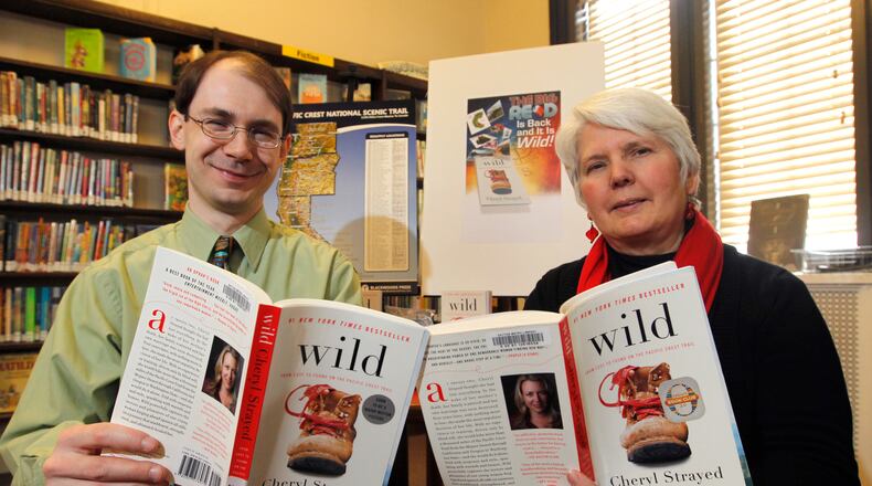 Archived photo: Ben Murphy, then Dayton Metro Library adult materials selections specialist and Jean Gaffney, then manager of aquistion and collection department, were the co-chairs of the 2014 Big Read committee. The 2014 book was "Wild: Lost to Found on the Pacific Crest Trail," by Cheryl Strayed. LISA POWELL / STAFF