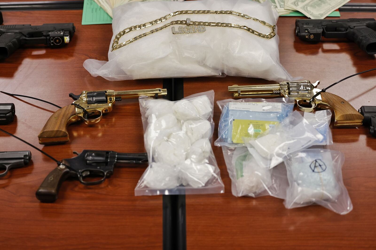 An extensive drug trafficking investigation resulted in the arrest of a Hamilton man and the seizure of drugs, guns and cash, according to the Butler County Sheriff’s Office.