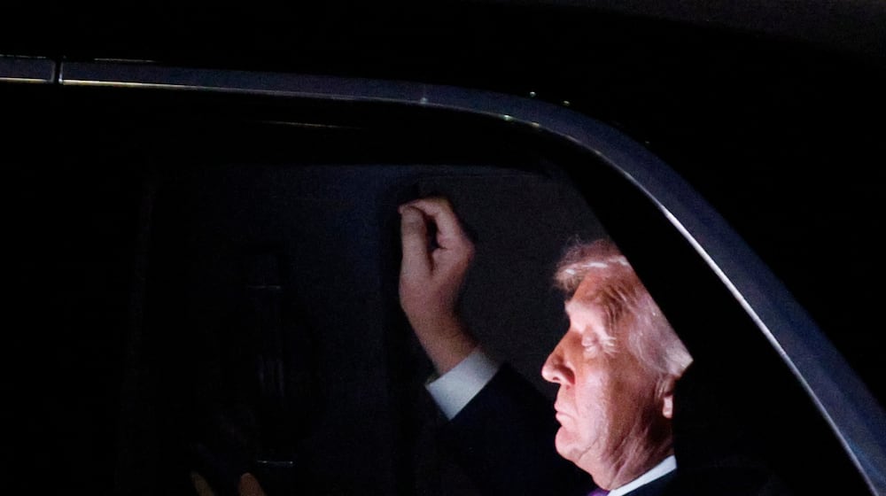 President Donald Trump is seen in his limousine, known as "The Beast," for the motorcade to the White House after his arrival on Air Force One at Joint Base Andrews, Md., Wednesday, March 11, 2026. (AP Photo/Luis M. Alvarez)