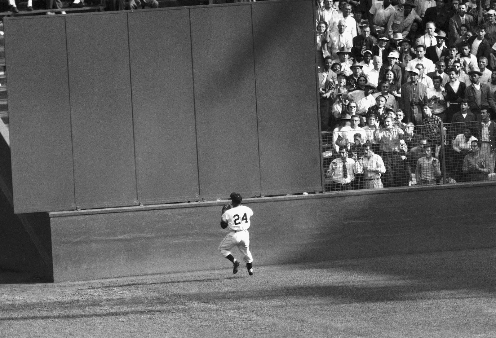 FILE - New York Giants' Willie Mays makes a catch of a ball hit by Cleveland Indians' Vic Wertz in Game 1 of the 1954 baseball World Series in New York's Polo Grounds on Sept. 29, 1954. Mays, the electrifying “Say Hey Kid” whose singular combination of talent, drive and exuberance made him one of baseball’s greatest and most beloved players, has died. He was 93. Mays' family and the San Francisco Giants jointly announced Tuesday night, June 18, 2024, he had “passed away peacefully” Tuesday afternoon surrounded by loved ones. (AP Photo, File)