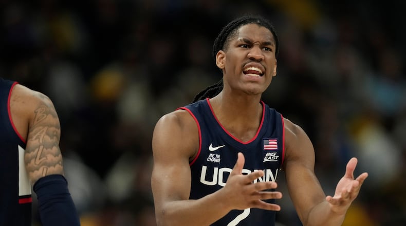 UConn's Silas Demary Jr. reacts during the first half of an NCAA college basketball game against Marquette, Saturday, March 7, 2026, in Milwaukee. (AP Photo/Aaron Gash)