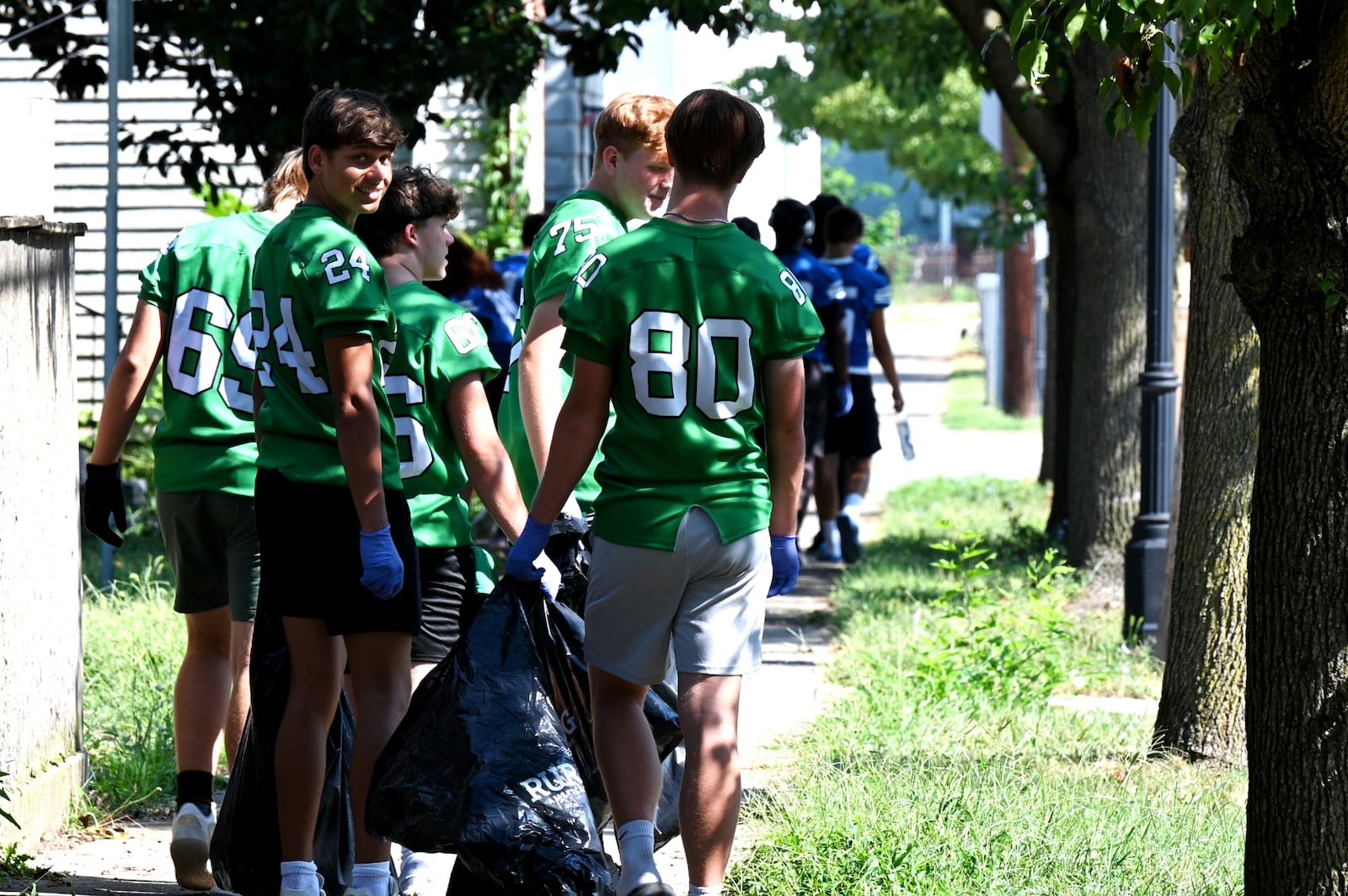 Hamilton and Badin play each other on Friday night, Aug. 22, 2025, in the season opener for Ohio high school football. However, the intercity athletic rivals teamed up on Saturday morning, Aug. 16, 2025, to help clean up part of their hometown, including the Booker T. Washington Center and Bailey Square. MICHAEL D. PITMAN/STAFF