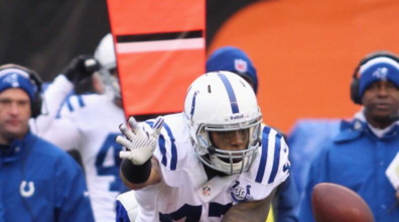 CINCINNATI, OH - DECEMBER 08: Chris Crocker #32 of the Cincinnati Bengals battles for the ball with Weslye Saunders #47 of the Indianapolis Colts during their game at Paul Brown Stadium on December 8, 2013 in Cincinnati, Ohio. The Bengals defeated the Colts 42-28. (Photo by John Grieshop/Getty Images)