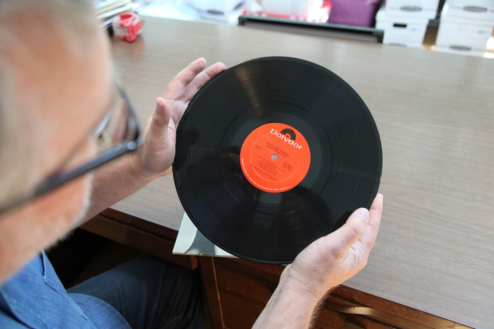 Music historian and journalist Brian Mansfield holds an original pressing of the "Buckingham Nicks" vinyl record at his home in Nashville, Tenn., Wednesday, July 23, 2025. (AP Photo/Kristin M. Hall)