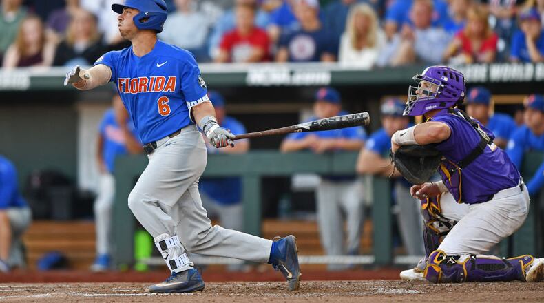 OMAHA, NE - JUNE 26: Third basemen Jonathan India #6 of the Florida Gators hits a two run double against the LSU Tigers in the third inning during game one of the College World Series Championship Series on June 26, 2017 at TD Ameritrade Park in Omaha, Nebraska. (Photo by Peter Aiken/Getty Images)