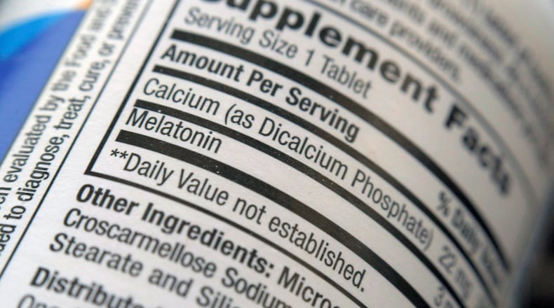 FILE - The label for a bottle of melatonin pills is seen in New York on Thursday, June 2, 2022. (AP Photo/Patrick Sison, File)
