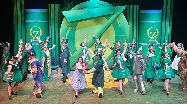 The cast of La Comedia Dinner Theatre's production of "The Wizard of Oz" performs "Merry Old Land of Oz." PHOTO BY JUSTIN WALTON
