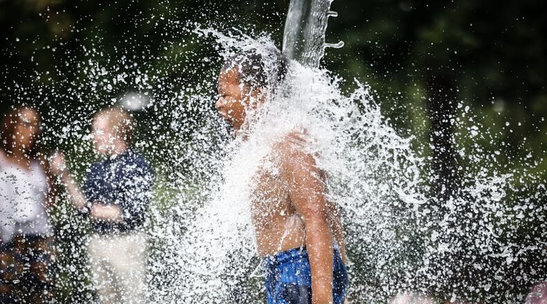 Local splash pads and other places to help cool folks down are open throughout Southwest Ohio. FILE PHOTO