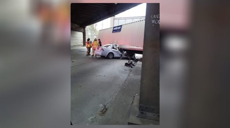 A 12-year-old and her mother are continuing to recover from a crash earlier this month when a storage unit fell from a semi truck crushing their car on Ohio 4 at the train trestle overpass in Fairfield. CONTRIBUTED