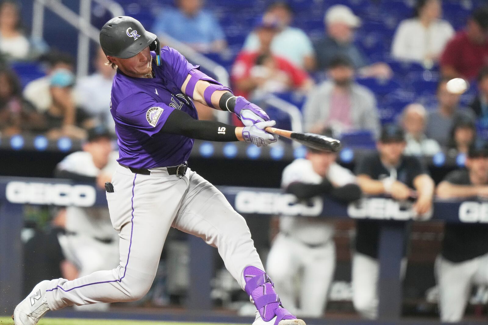 Colorado Rockies' Hunter Goodman hits a solo home run during the eighth inning of a baseball game against the Miami Marlins, Tuesday, June 3, 2025, in Miami. (AP Photo/Lynne Sladky)