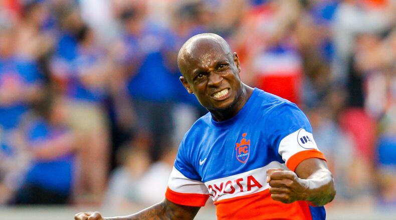 FC Cincinnati defender Justin Hoyte (32) celebrates after a goal by Djiby Fall (9) during their Open Cup match against the Columbus Crew, held at Nippert Stadium on the campus of the University of Cincinnati, Wednesday, June 14, 2017. GREG LYNCH / STAFF