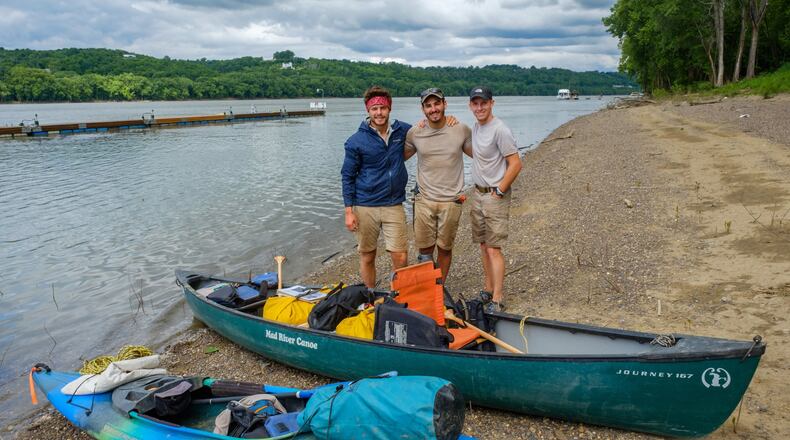 Pictured on their trip down the Ohio River last year with their gear are, from left, Quenton Couch, Jackson Gray and Tyler Brezina. CONTRIBUTED