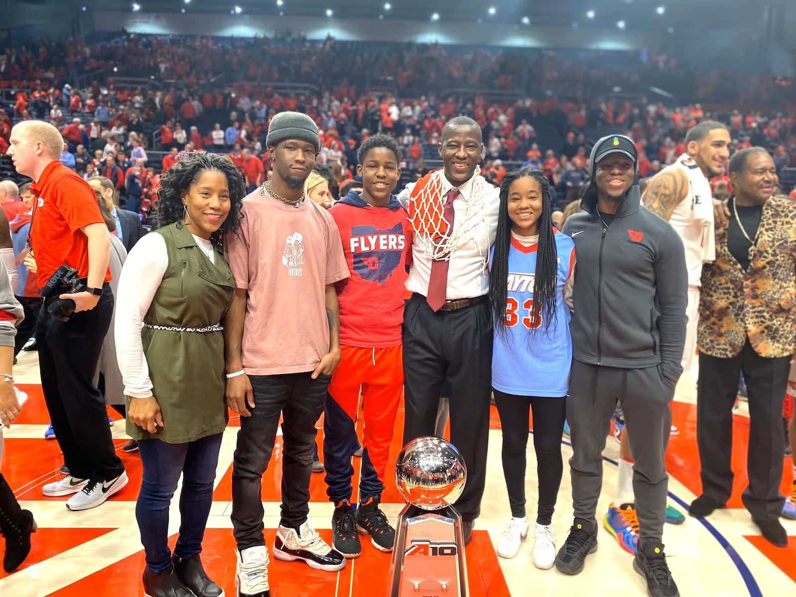 The Grant family celebrated the No. 3 Dayton Flyers finishing the 2019-20 regular season with a 76-51 Senior Night victory over George Washington on March 7, 2020. With the win, the 29-2 Flyers finished the regular season unbeaten in the Atlantic 10 and at UD Arena. Pictured left to right are Chris, A.J. Makai, Anthony – who would be named the National College Coach of the Year – Jayda and Preston. In the back on the right is UD’s Obi Toppin, the national collegiate player of the year, and former Flyer, the Rev. J.D Grigsby. CONTRIBUTED