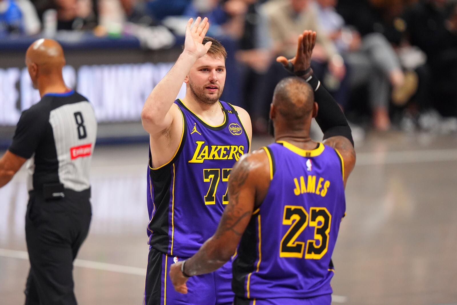Los Angeles Lakers' Luka Doncic (77) and LeBron James (23) celebrate in the second half of an NBA basketball game against the Dallas Mavericks in Dallas, Wednesday, April 9, 2025. (AP Photo/LM Otero)