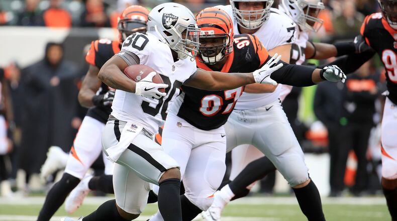 CINCINNATI, OH - DECEMBER 16: Jalen Richard #30 of the Oakland Raiders attempts to run the ball past Geno Atkins #97 of the Cincinnati Bengals during the first quarter at Paul Brown Stadium on December 16, 2018 in Cincinnati, Ohio. (Photo by Andy Lyons/Getty Images)