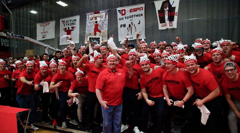 Dayton football coach Rick Chamberlin poses for a photo with his team during ESPN’s College GameDay at the Frericks Center in Dayton on Saturday, March 7, 2020. David Jablonski/Staff