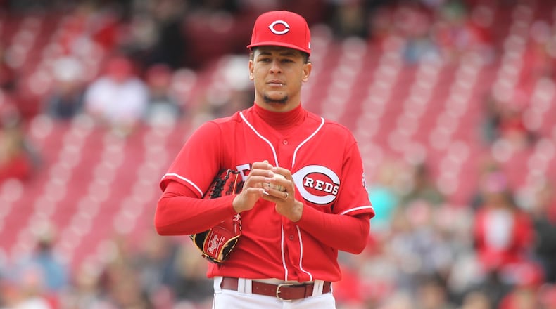 Reds starter Luis Castillo reacts after giving up a home run to the Nationals on March 31, 2018, at Great American Ball Park in Cincinnati. David Jablonski/Staff