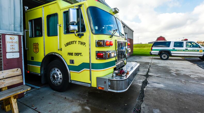 A crew with Liberty Township Fire Department responds to a call from their Yankee Road Station, the oldest of their three buildings in Liberty Twp. NICK GRAHAM/STAFF