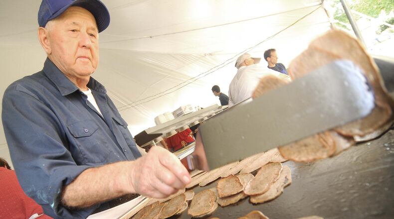 Gyros will be available for purchase at this weekend’s Greek Fest this weekend. FILE PHOTO Costa Sotiroglou flips the lamb meat for the Gryos being made for the 46th annual Greek Fest Saturday, July 27, 2013 in Middletown. Several Thousand people are expected to attend the three day annual event at Sts. Constantine and Helen Greek Orthodox Church. (CONTRIBUTED BY MARTIN WHEELER)