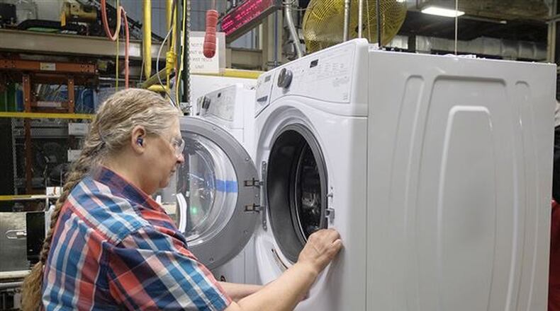 Anna Snyder works on the assembly line building washing machines Thursday, October 18, 2017, at Whirlpool in Clyde Ohio. A trade war could impact customers of Whirlpool, which has three Ohio locations. JEREMY WADSWORTH/THE BLADE