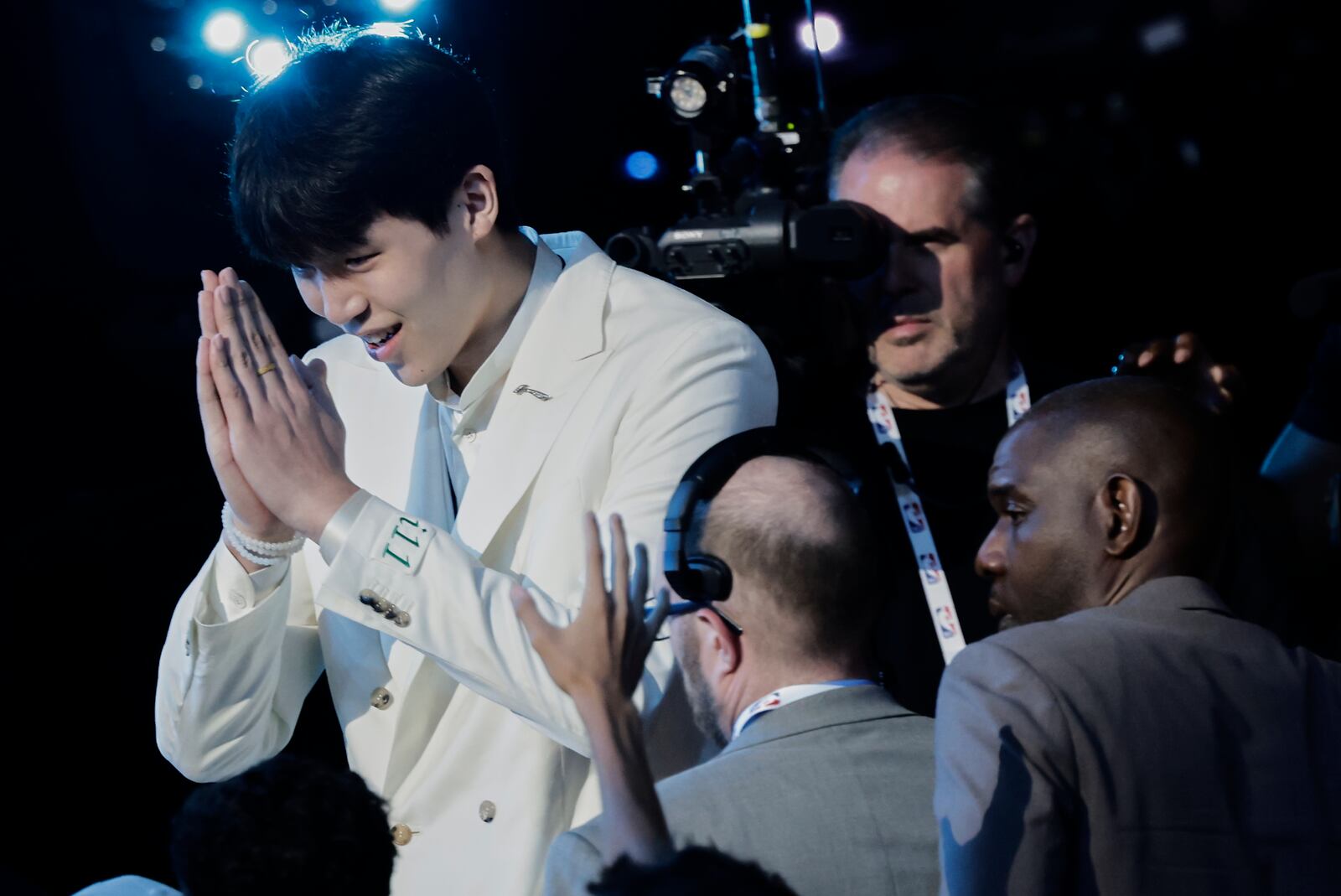 Yang Hansen reacts after being selected 16th by the Memphis Grizzlies in the first round of the NBA basketball draft, Wednesday, June 25, 2025, in New York. (AP Photo/Adam Hunger)
