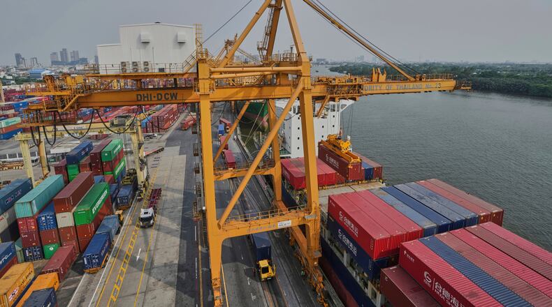FILE - Cranes work on stacks of containers at the Bangkok Port in Bangkok, Thailand, Thursday, April 10, 2025. (AP Photo/Sakchai Lalit, File)