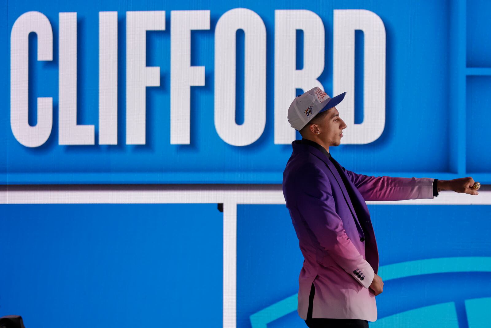Nique Clifford poses for a camera after being selected 24th by the Oklahoma City Thunder in the first round of the NBA basketball draft, Wednesday, June 25, 2025, in New York. (AP Photo/Adam Hunger)