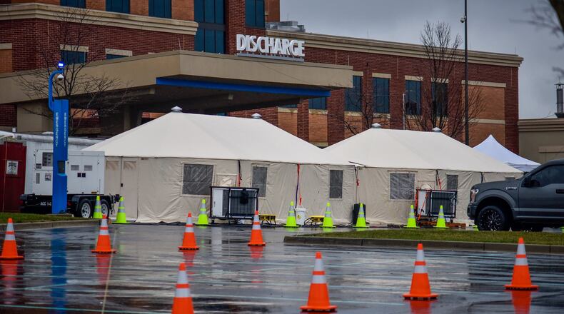 Special tents have been erected outside the emergency area of Atrium Medical Center in Middletown to deal with the coronavirus (COVID-19) outbreak. NICK GRAHAM / STAFF