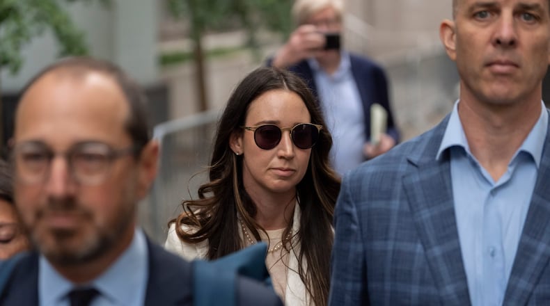 FILE - Charlie Javice, center, exits Manhattan federal court, Monday, Sept. 29, 2025, in New York. (AP Photo/Yuki Iwamura, File)