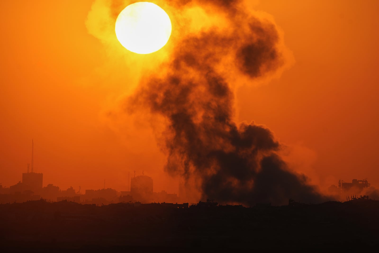 Smoke billows from an explosion in the northern Gaza Strip, as seen from southern Israel Wednesday, July 23, 2025. (AP Photo/Ohad Zwigenberg)