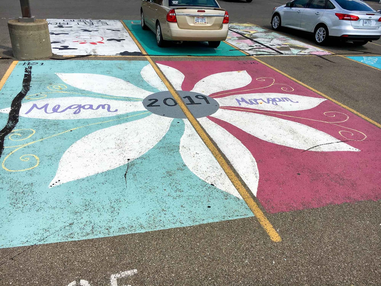 PHOTOS Lakota East seniors paint parking spots
