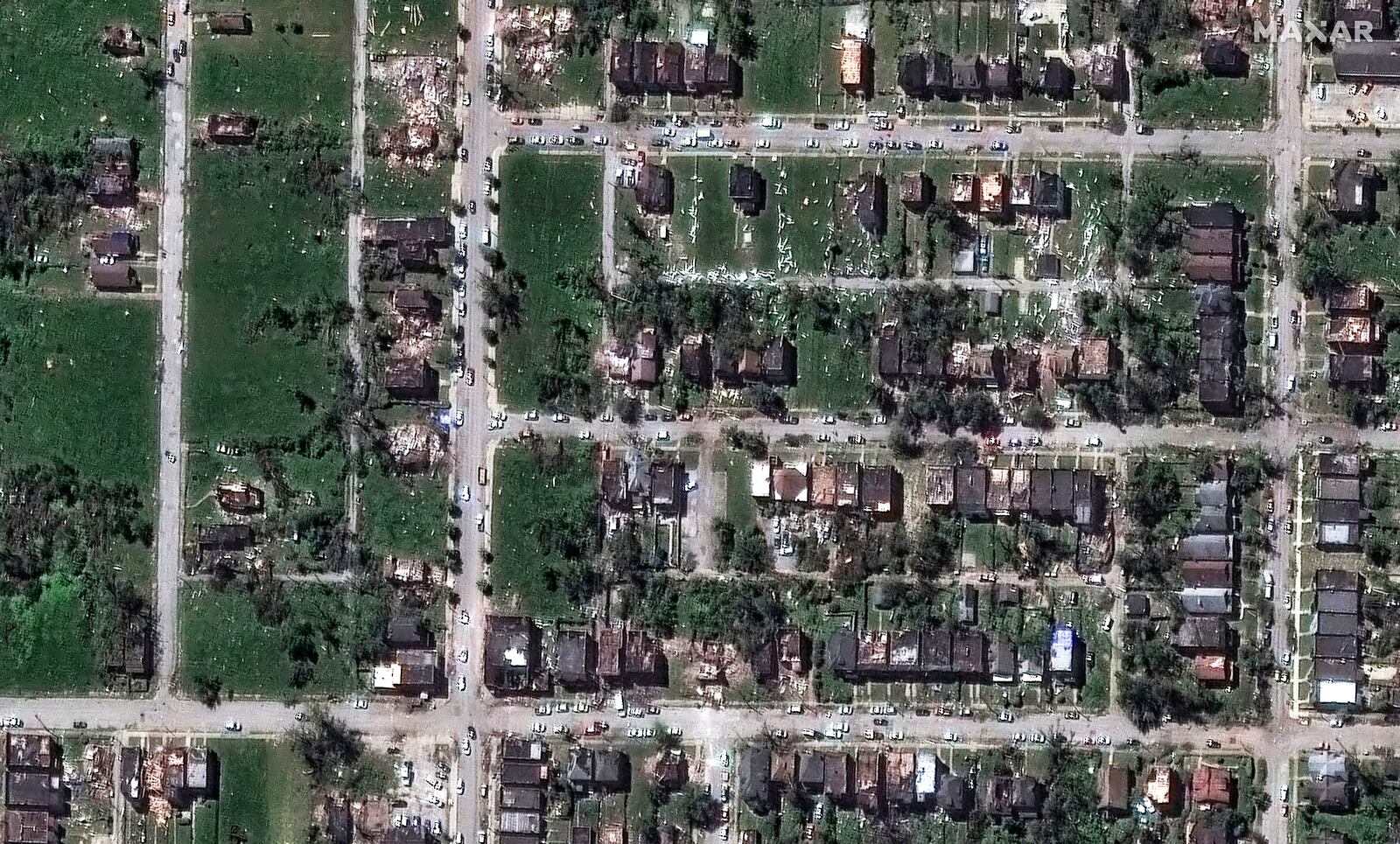 This satellite image provided by Maxar Technologies shows houses after they were damaged by a tornado near Ashland Avenue, Monday, May 18, 2025, in northwest St. Louis. (Maxar Technologies via AP)