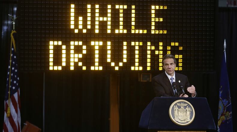 In this May 31, 2013, file photo, New York Gov. Andrew Cuomo speaks during a news conference to announce the increase in penalties for texting while driving in New York. New York state is set to study the use of a device known as the textalyzer that would allow police to determine whether a motorist involved in a serious crash was texting while driving. Cuomo announced July 26, that he would direct the Governor s Traffic Safety Committee to examine the technology, as well as the privacy and constitutional questions it could raise. (AP Photo/Frank Franklin II, File)