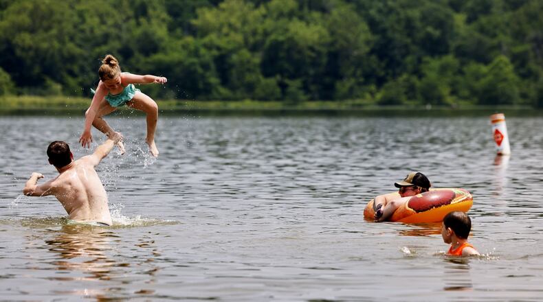 The Hamilton family cools off in Acton Lake at Hueston Woods State Park Monday, June 17, 2024. NICK GRAHAM/STAFF