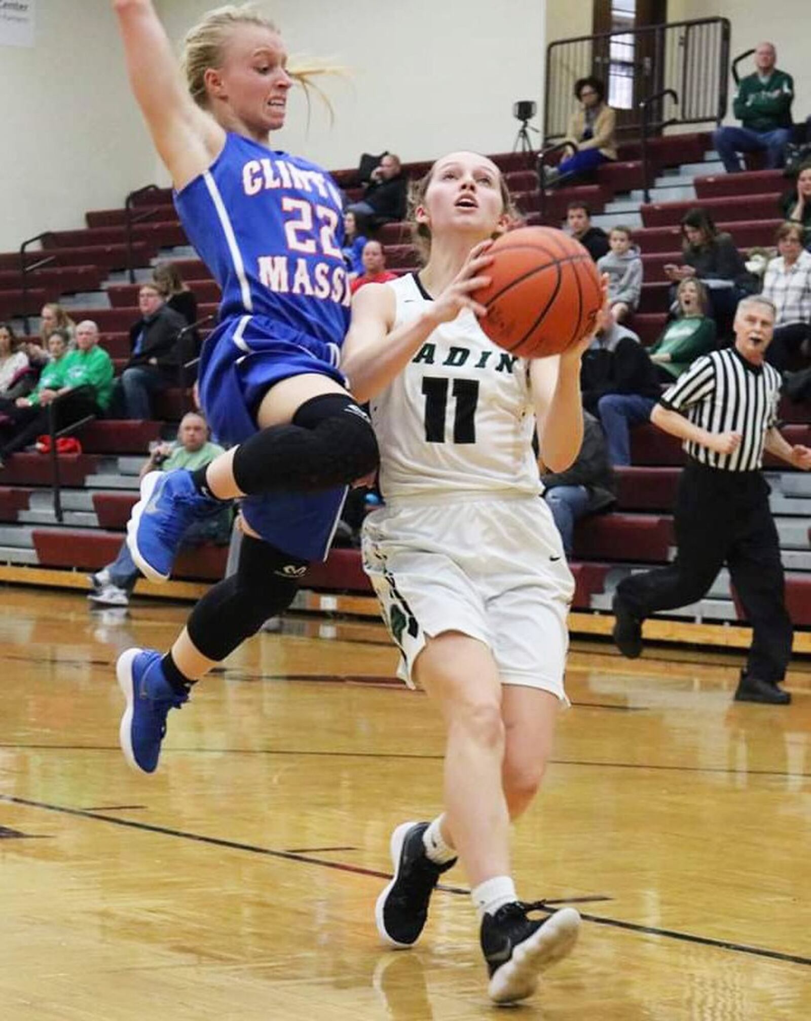 Clinton-Massie’s Emily Ireland (22) goes high to try to stop Badin’s Emily Maher from scoring during Saturday afternoon’s Division II sectional opener at Lebanon. Badin won 54-10. CONTRIBUTED PHOTO BY TERRI ADAMS