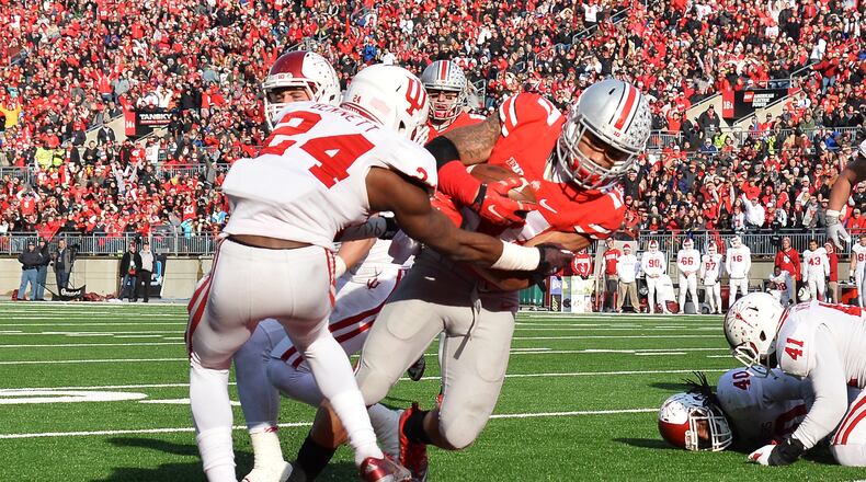 COLUMBUS, OH - NOVEMBER 22: Jalin Marshall #17 of the Ohio State Buckeyes scores on a six-yard touchdown pass reception in the fourth quarter against the Indiana Hoosiers at Ohio Stadium on November 22, 2014 in Columbus, Ohio. Marshall scored four touchdowns in the second half to pace Ohio State to a 42-27 victory over Indiana. (Photo by Jamie Sabau/Getty Images)