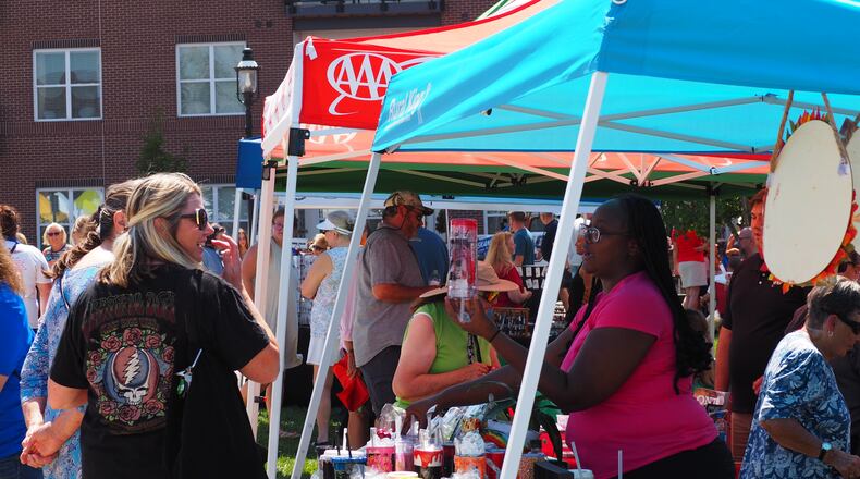 Hamilpalooza is a family-friendly, one-day event that offers dozens of vendor booths, food trucks, music, and more. Pictured is a shot from the crowd at the 2022 Hamilpalooza at Marcum Park and parts of downtown Hamilton. FILE PHOTO/ANANTH RAMAN (CONTRIBUTOR)