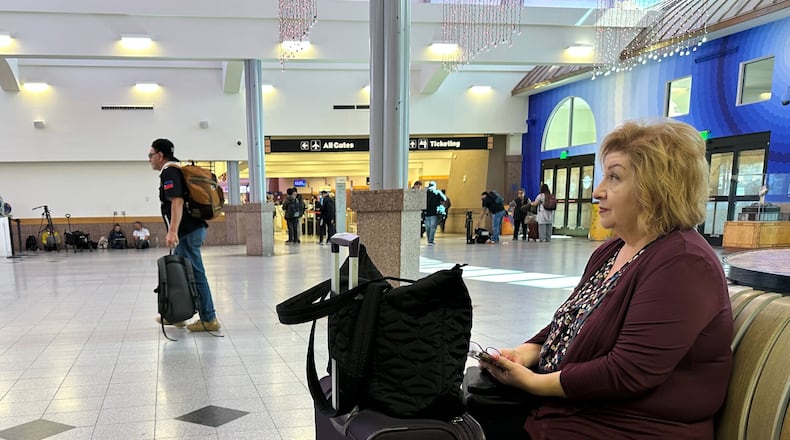 Rosie Leal sits at El Paso International Airport, Wednesday, Feb. 11, 2026, in El Paso, Texas. (AP Photo/Morgan Lee)