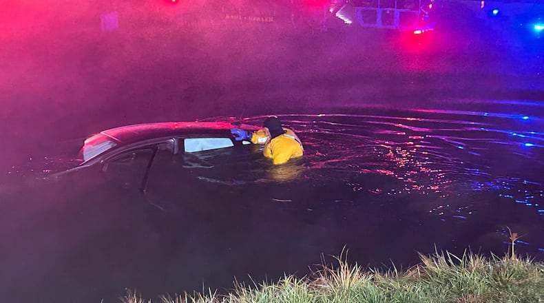 A West Chester Twp. firefighter saved an elderly man who drove car into a pond Thursday evening, officials say. CONTRIBUTED/WEST CHESTER TWP.