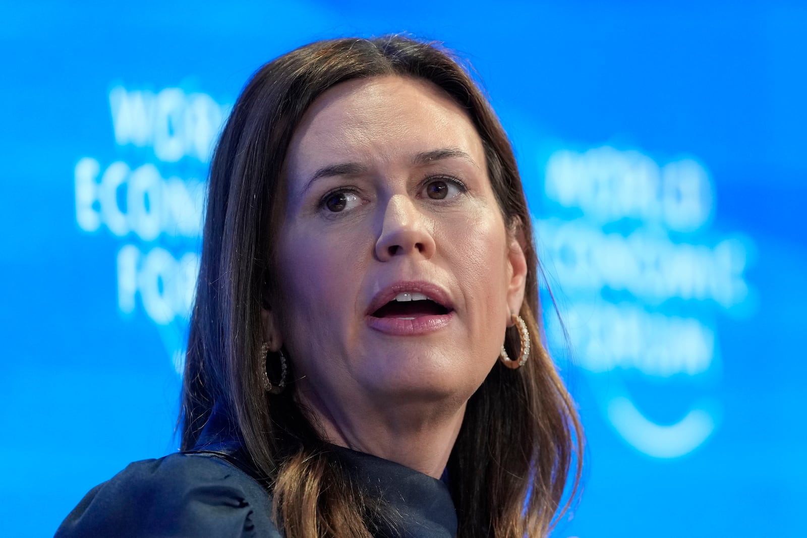 FILE - Arkansas Gov. Sarah Huckabee Sanders speaks at the Annual Meeting of World Economic Forum in Davos, Switzerland, Jan. 23, 2025. (AP Photo/Markus Schreiber, File)