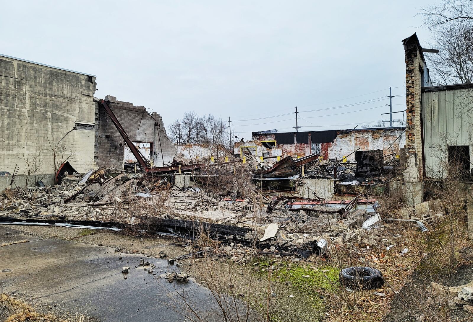 Debris remains Wednesday, Dec.. 30, 2020 nearly a year after the former Middletown Paperboard complex was destroyed by fire. Firefighters from multiple departments battled the fire that started on January 1, 2020. NICK GRAHAM  / STAFF