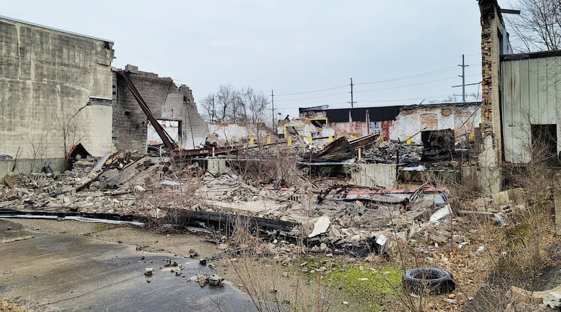 Debris remains Wednesday, Dec.. 30, 2020 nearly a year after the former Middletown Paperboard complex was destroyed by fire. Firefighters from multiple departments battled the fire that started on January 1, 2020. NICK GRAHAM / STAFF