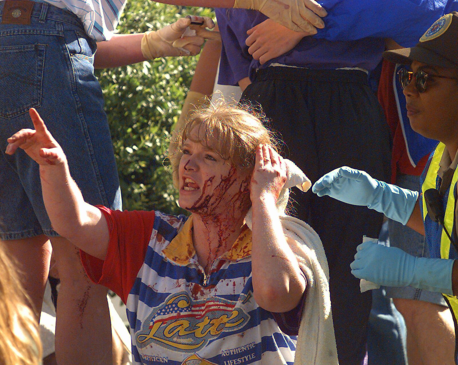FILE - An unidentified woman calls out to friends as she waits for treatment following a bomb blast at the Alfred P. Murrah Federal Building in downtown Oklahoma City, April 19, 1995. (AP Photo/David Longstreath, File)