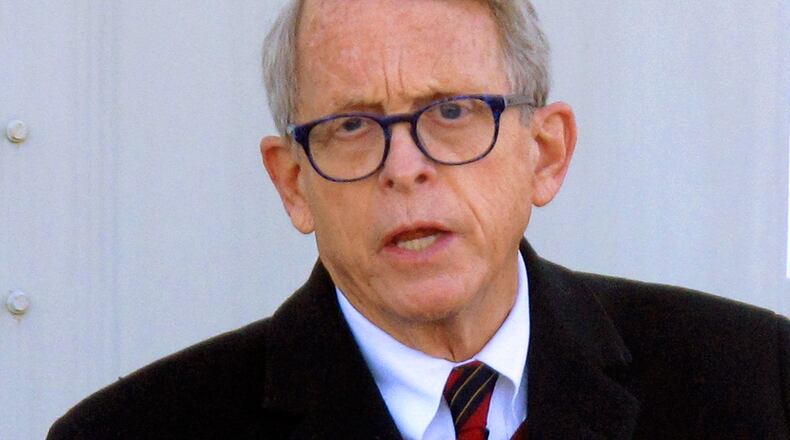 FILE - In this Nov. 18, 2020, file photo, Republican Ohio Gov. Mike DeWine speaks during a news briefing in Columbus, Ohio. Ohioans ages 12-25 who receive the coronavirus vaccine can enter a new lottery making them eligible for five $100,000 college scholarships and 50 $10,000 scholarships, Gov. DeWine announced Thursday, Sept. 23, 2021, in his latest effort to boost number of people vaccinated against COVID-19. (AP Photo/Andrew Welsh-Huggins, File)