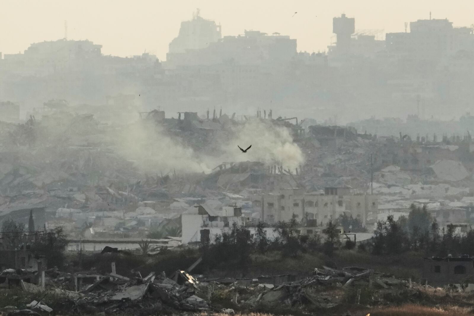 Buildings that were destroyed during the Israeli ground and air operations in the Gaza Strip are seen from southern Israel on Sunday, May 4, 2025. (AP Photo/Ariel Schalit)