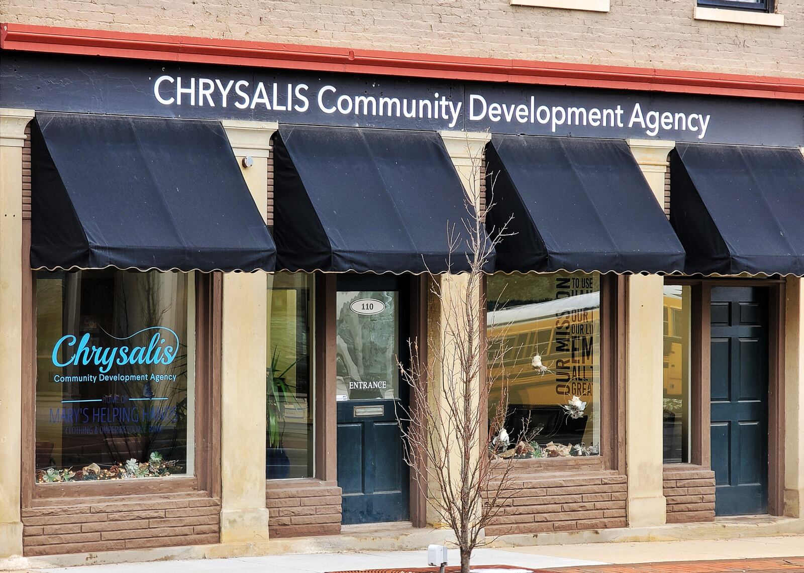 The non-profit Chrysalis Community Development Agency celebrated its new location Monday, on Main Street just across the High Street Bridge, with a ribbon cutting. The charitable organization supports needy children and their families through distributing diapers, infant clothing as well as food baskets. And it will soon be providing classes next month in child care instruction and financial education to young mothers. (Photo By Nick Graham\Journal-News)