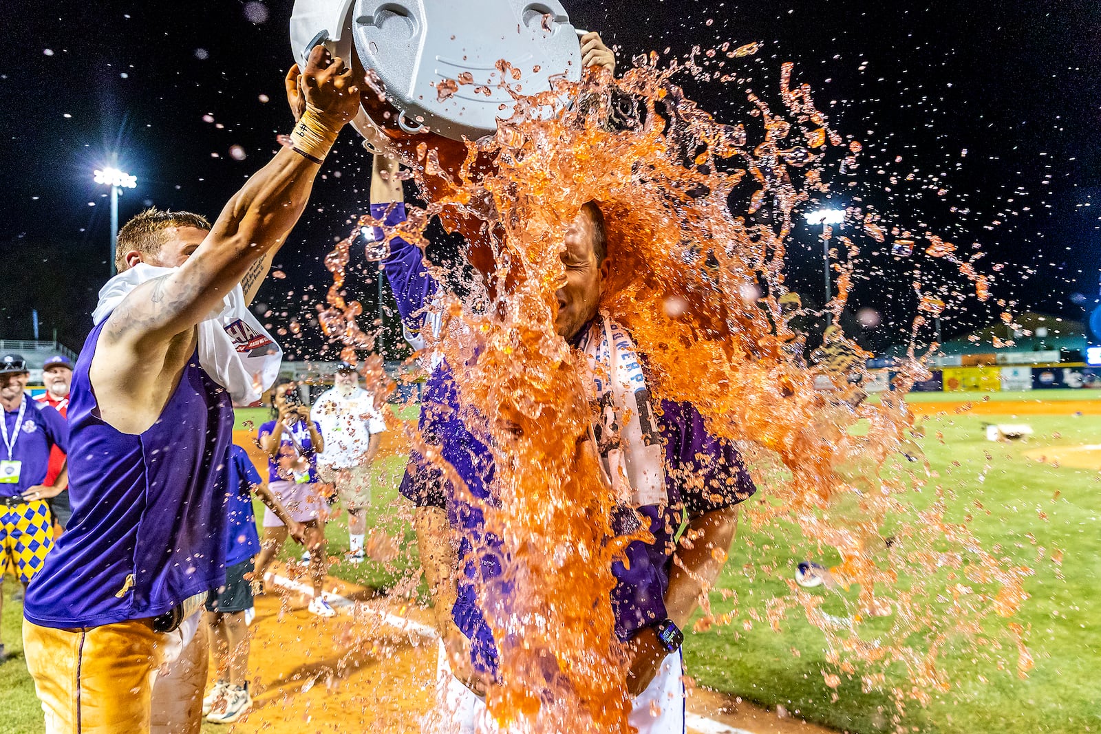 LSU Shreveport head coach Brad Neffendorf is doused by his players after defeating Southeastern of Florida to win the championship game of the NAIA World Series college baseball game, Friday, May 30 2025, at Harris Field in Lewiston, Idaho. (August Frank/Lewiston Tribune via AP)