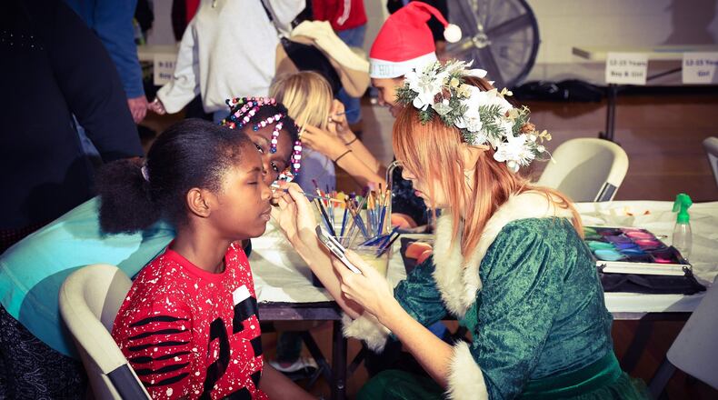 Feed the Hungry holds a Christmas party for hundreds of area children every year. This event and others are funded through the annual MLK Gala that will be held Saturday in West Chester. FILE PHOTO