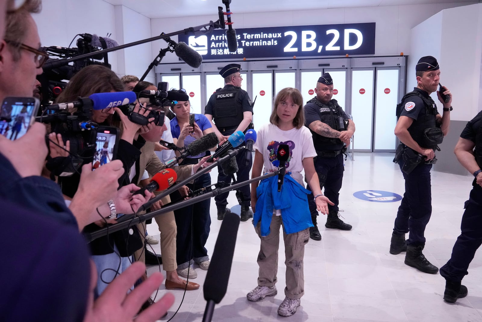 Activist Greta Thunberg arrives from Israel at Charles de Gaulle airport, north of Paris, Tuesday, June 10, 2025. (AP Photo/Michel Euler)